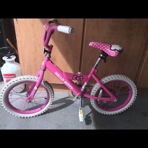16 G Hello kitty bicycle & Doc McStufins scooter.
